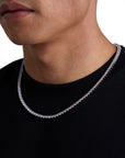 Model wearing 4mm white gold tennis necklace by Iceman Society, side view