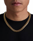 Model wearing 12mm 18k gold plain cuban necklace by Iceman Society
