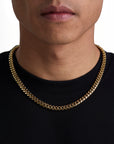 Model wearing 8mm 18k gold plain cuban necklace by Iceman Society