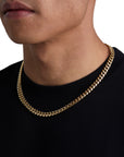 Model wearing 8mm 18k gold plain cuban necklace by Iceman Society, side view