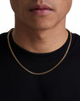 Model wearing 3mm 18K gold plain cuban chain set by Iceman Society, front view