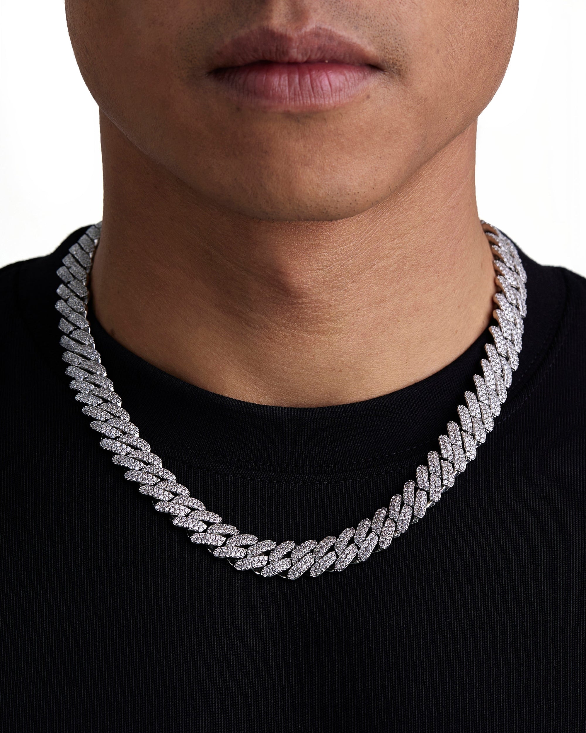Model wearing 13mm white gold ice prong cuban chain set by Iceman Society, front view