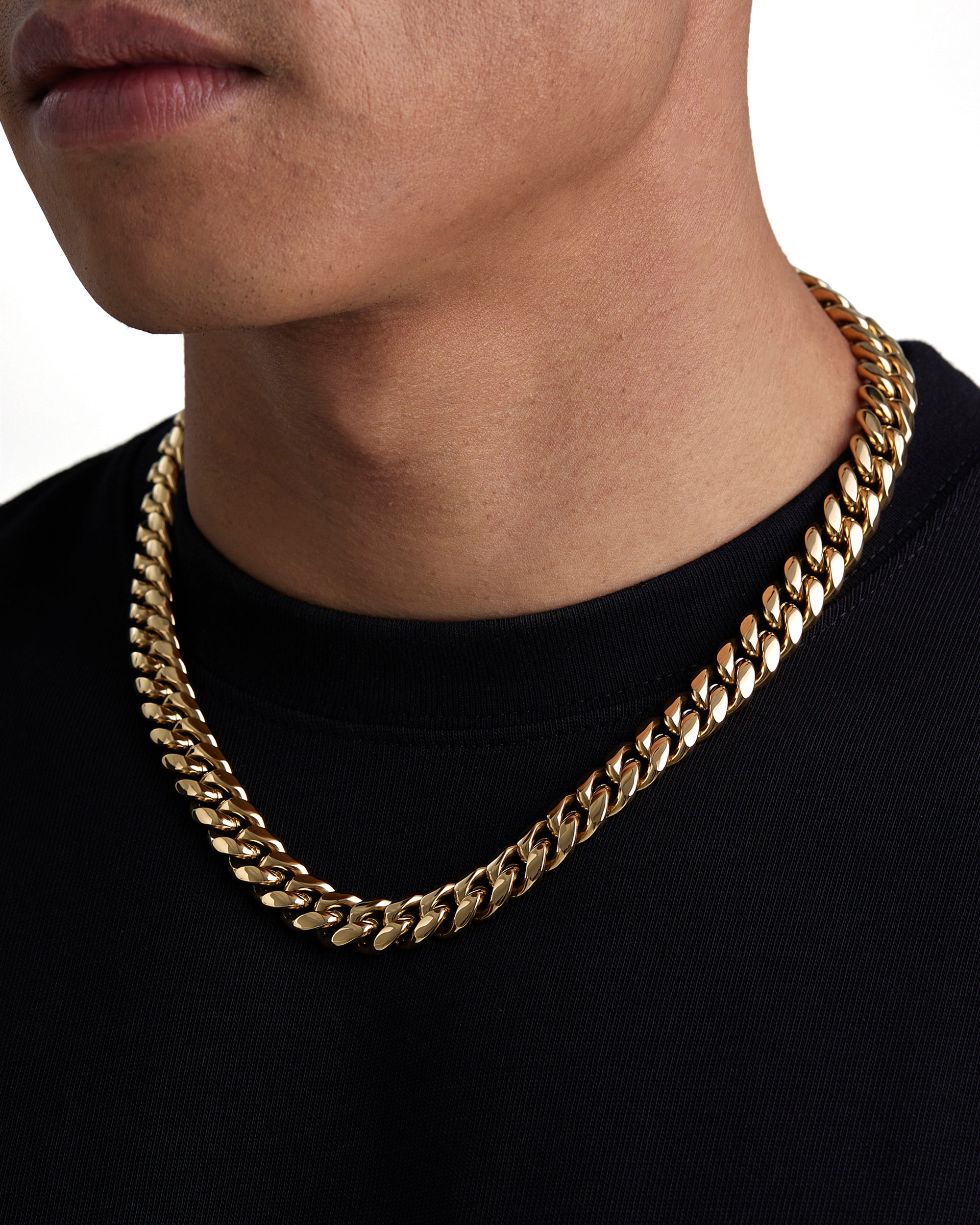 Model wearing 12mm 18k gold plain cuban necklace by Iceman Society, side view