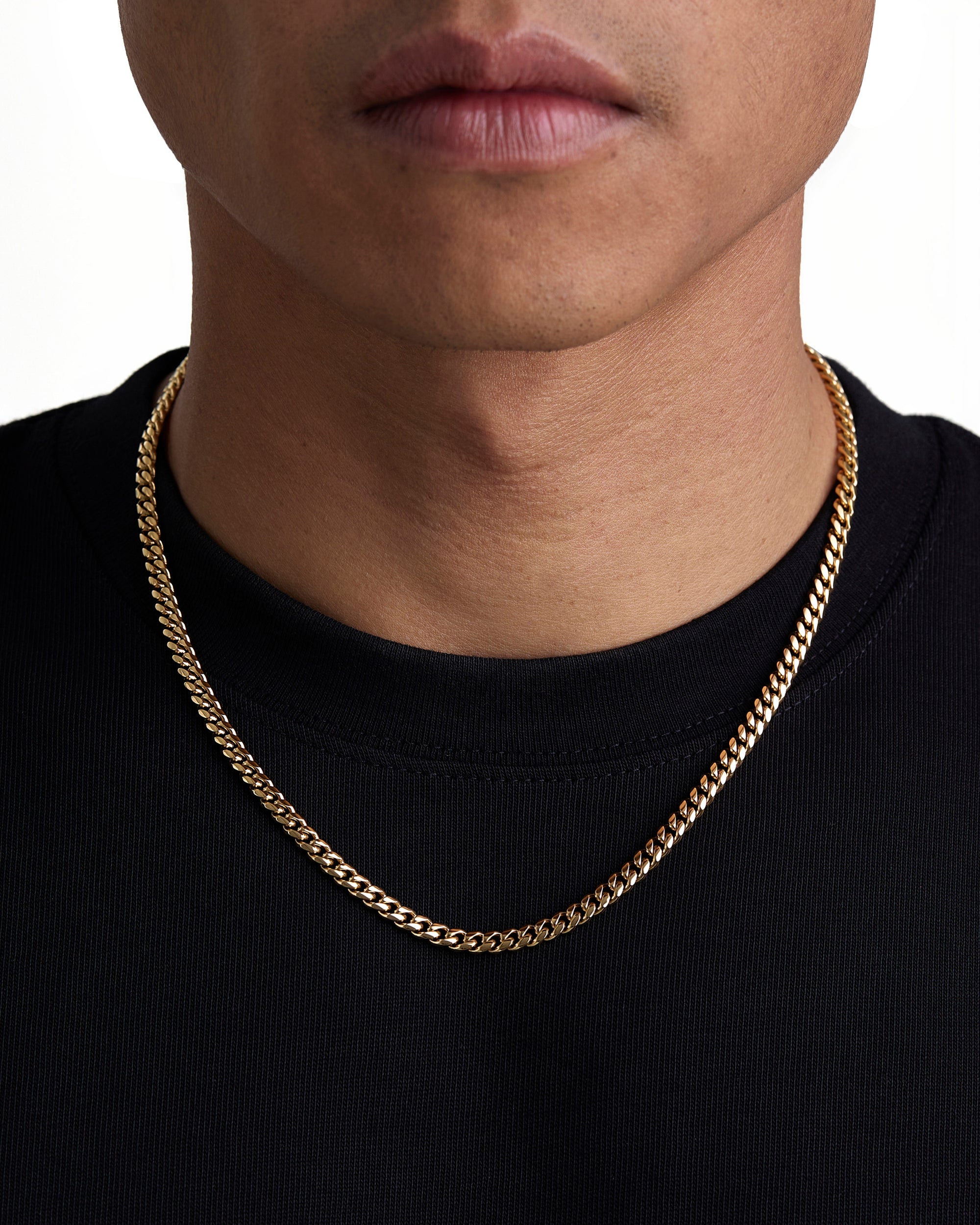 Model wearing 5mm 18k gold plain cuban necklace by Iceman Society