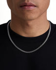 Model wearing 5mm white gold plain cuban necklace by Iceman Society