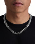 Model wearing 12mm white gold plain cuban chain set by Iceman Society, front view