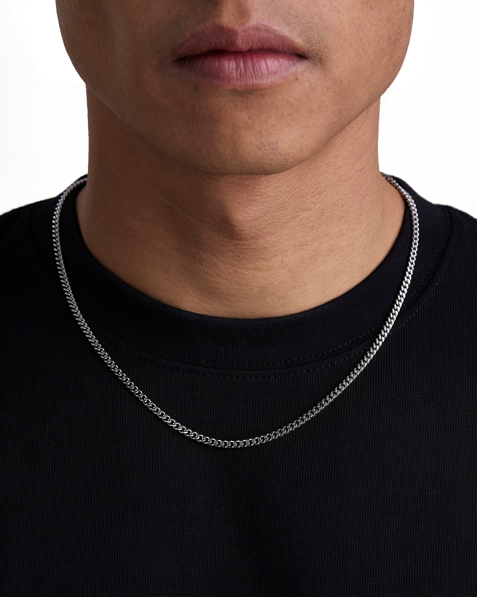 Model wearing 3mm white gold plain cuban chain set by Iceman Society, front view