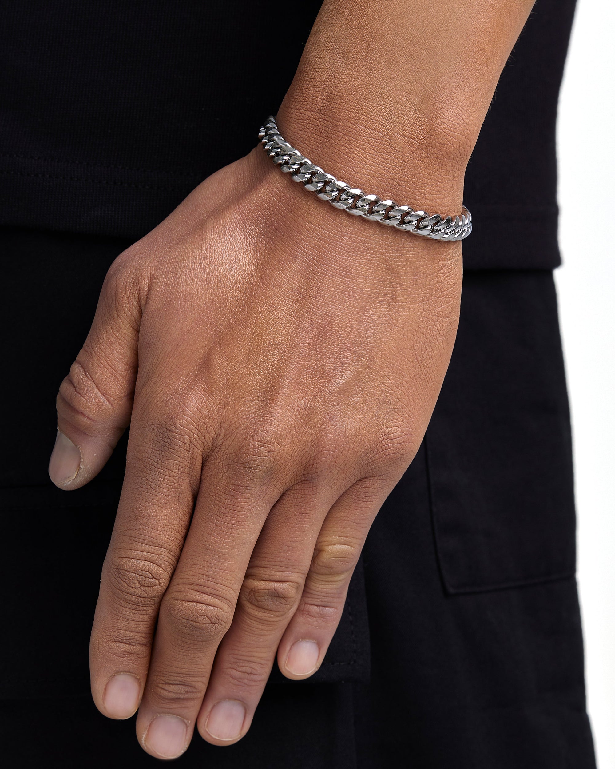 Model wearing 8mm white gold plain cuban chain set by Iceman Society, side view