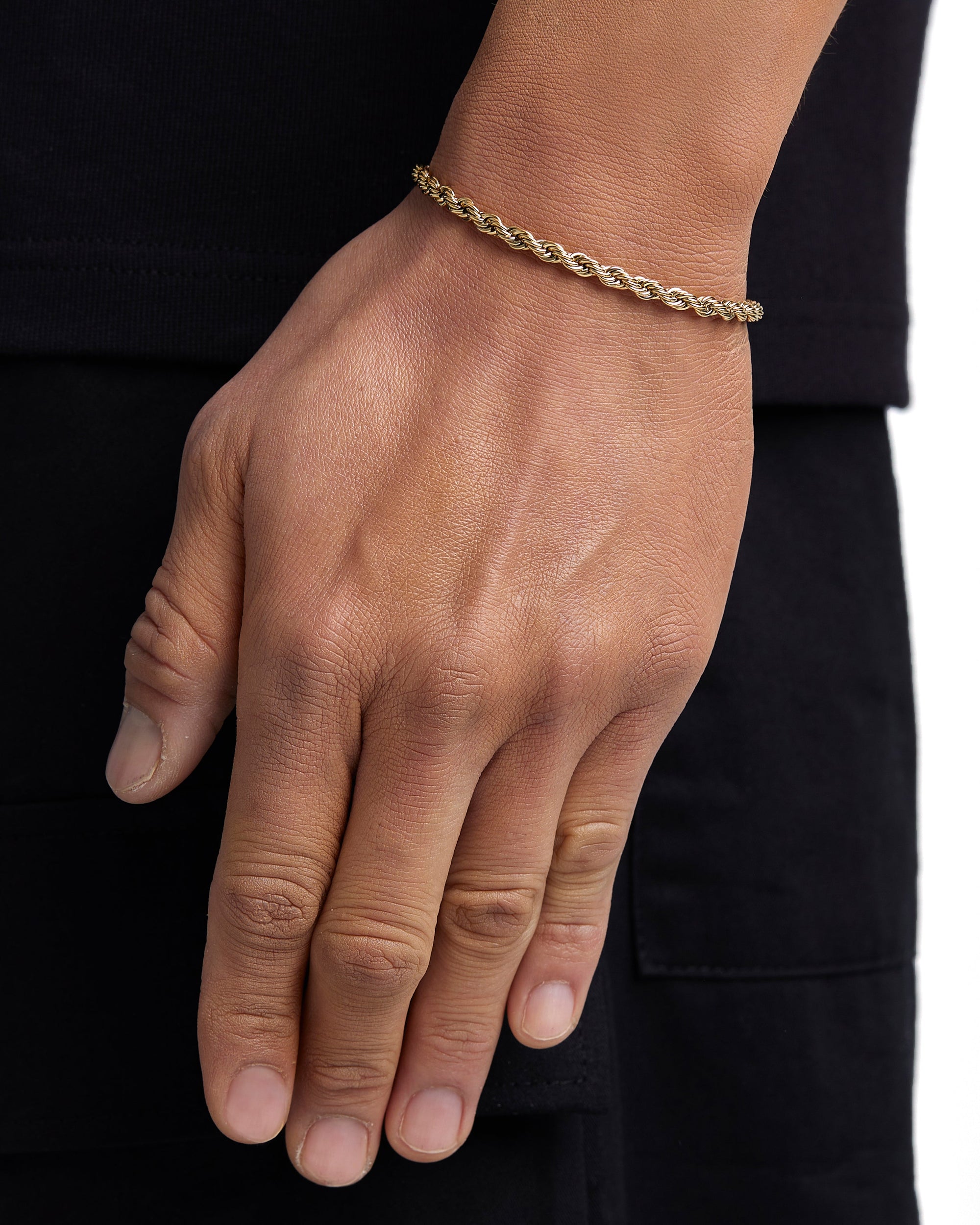 Model wearing 4mm 18k gold rope chain set by Iceman Society, side view