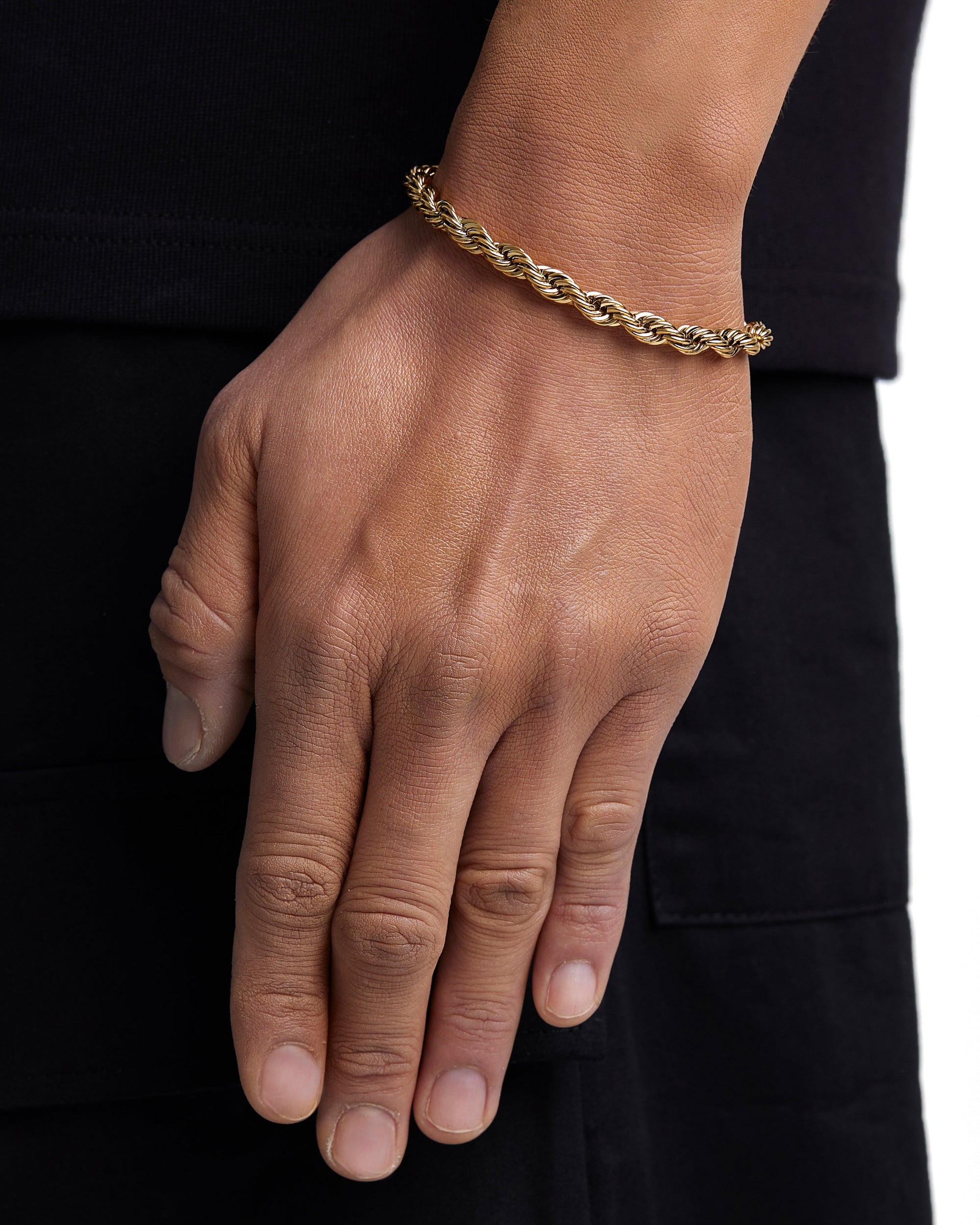 Model wearing 6mm 18k gold rope chain set by Iceman Society, side view